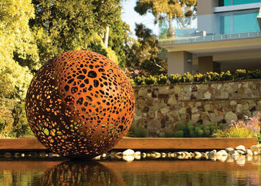 China Delicate Corten Steel Carved Hollow Ball Sculpture For Garden Decoration supplier