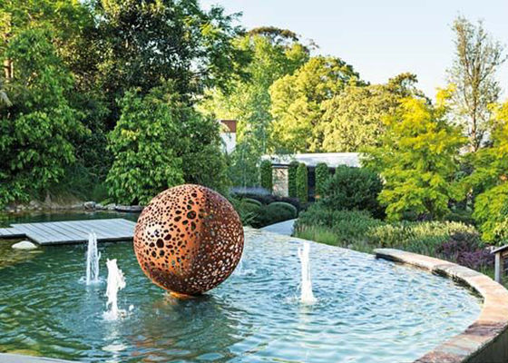 China Rusty Corten Steel Hollow Ball Sculpture For Garden supplier